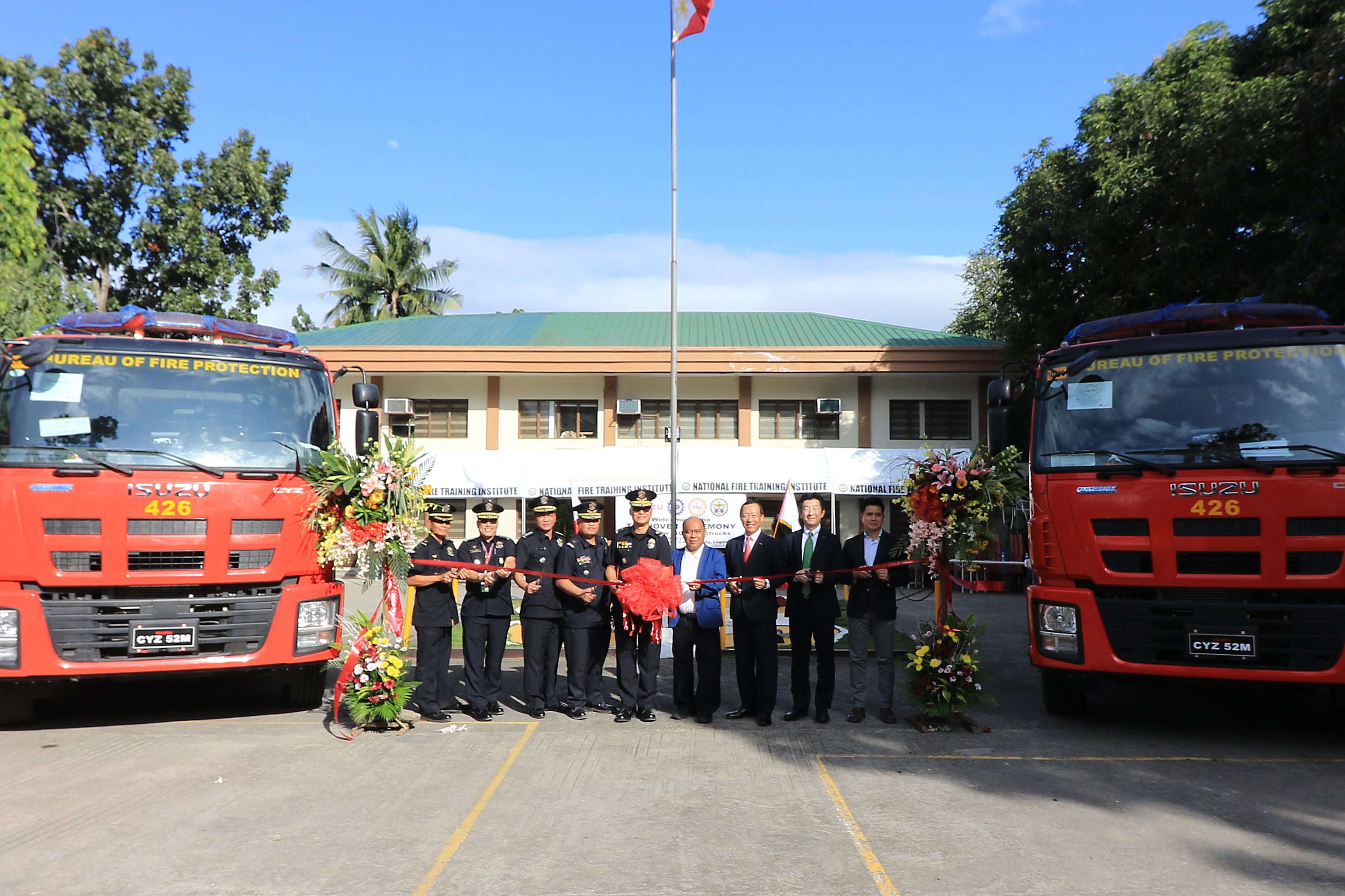 Ribbon cutting isuzu fire truck