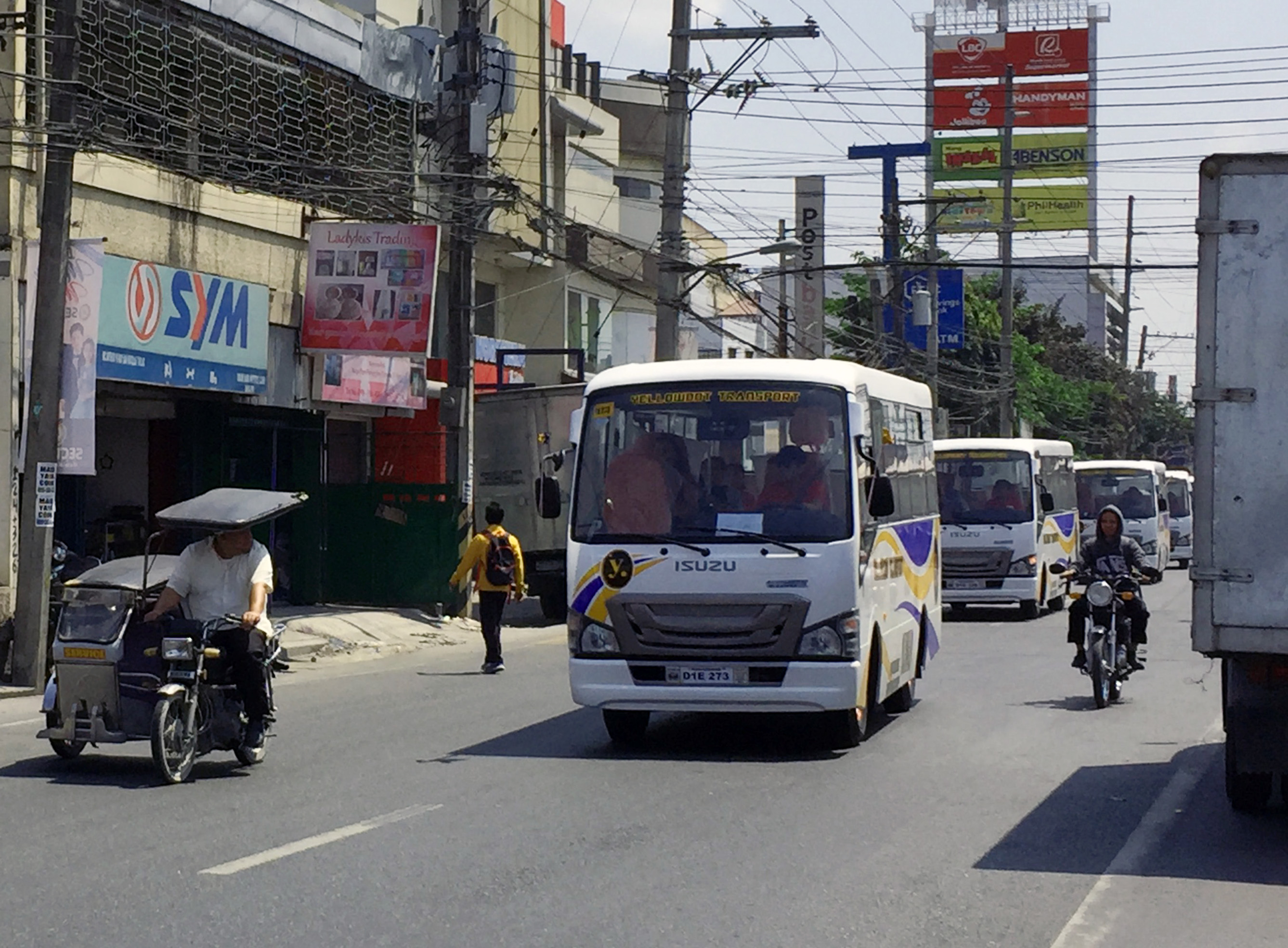 Isuzu buses on road